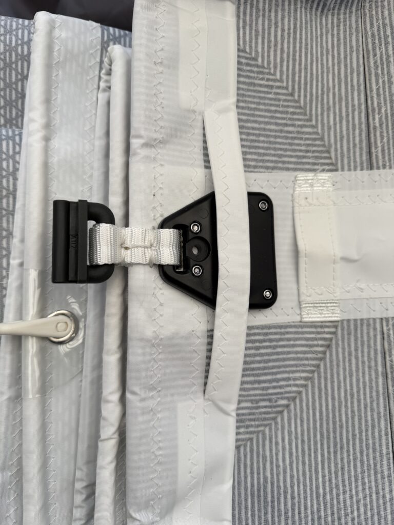 This shows a full length batten terminating into a compression slide. You can also see the overhead leech line coming down past the batten leech box which is fibre reinforced nylon with stainless through-sail bolts.