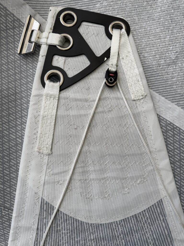 Headboard showing detail of a light coastal overhead leech line configuration with a Ronstan pulley.